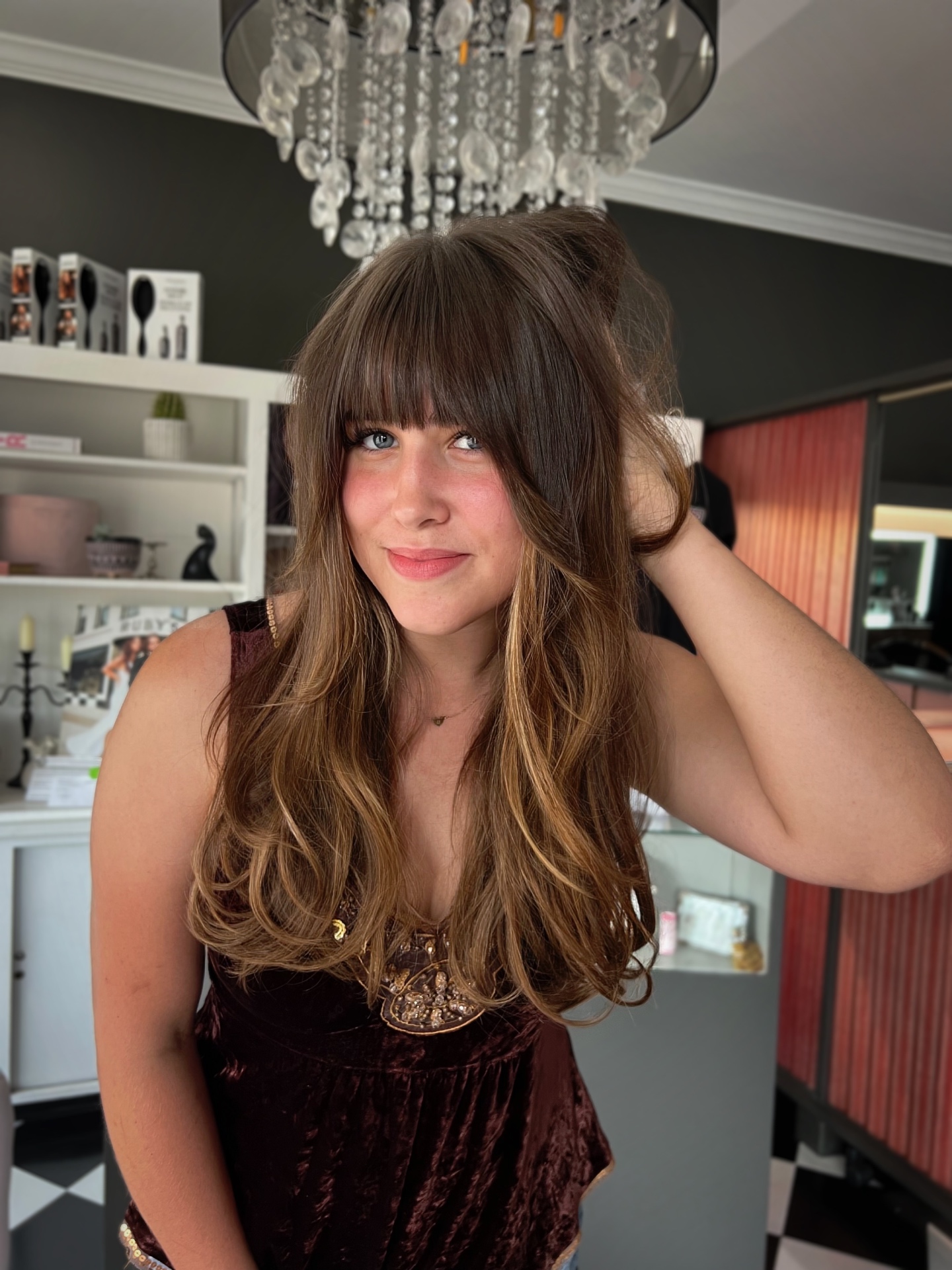 Brunette lived-in color with curtain bangs and long layers by Mill & Mane, Tipp City