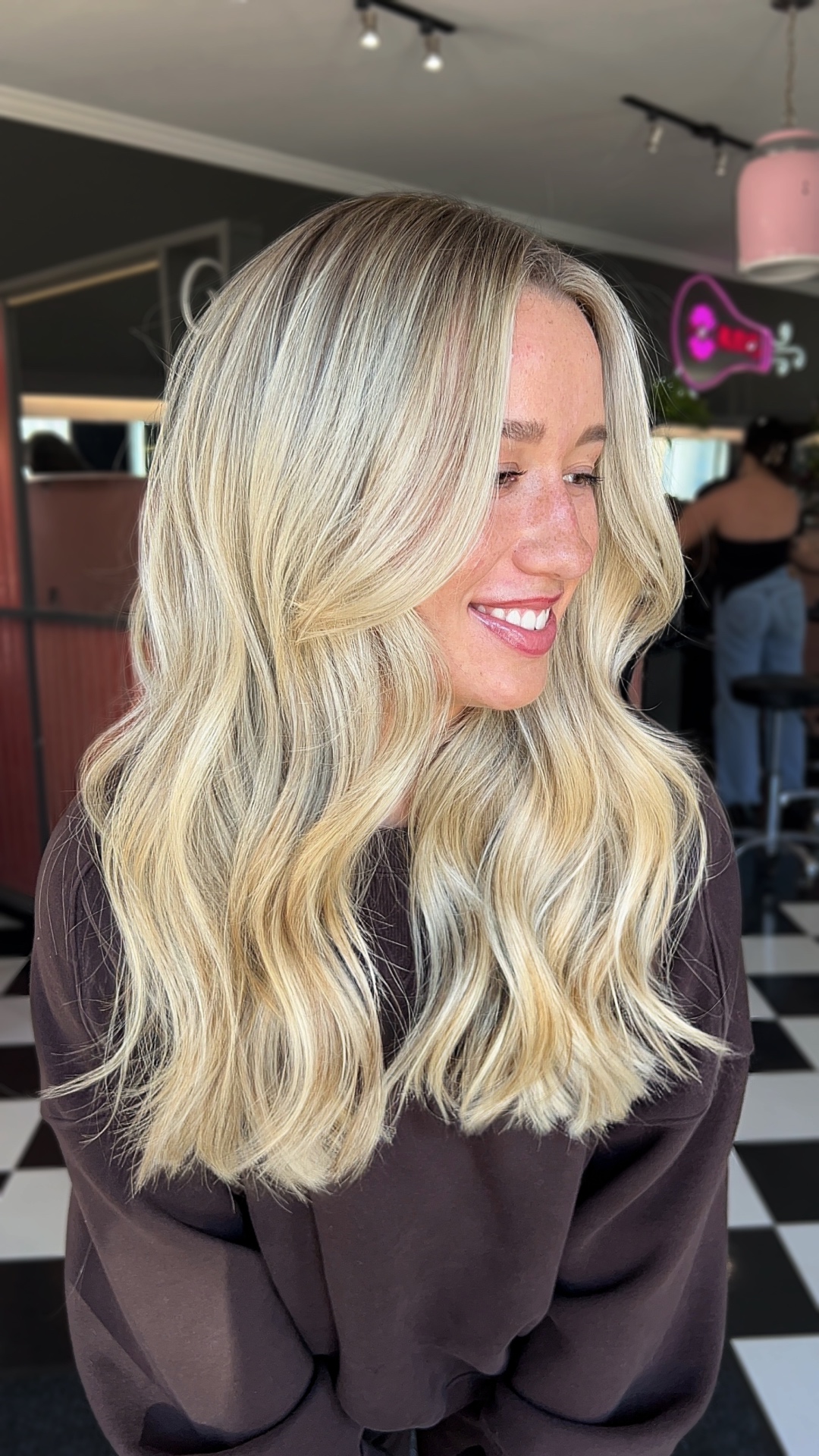 Bright blonde highlights with tousled waves styled at Mill & Mane in Tipp City, OH