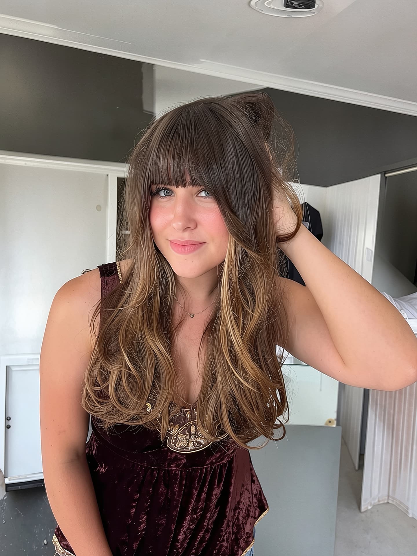 Brunette balayage with curtain bangs and long layers by Mill & Mane, Tipp City