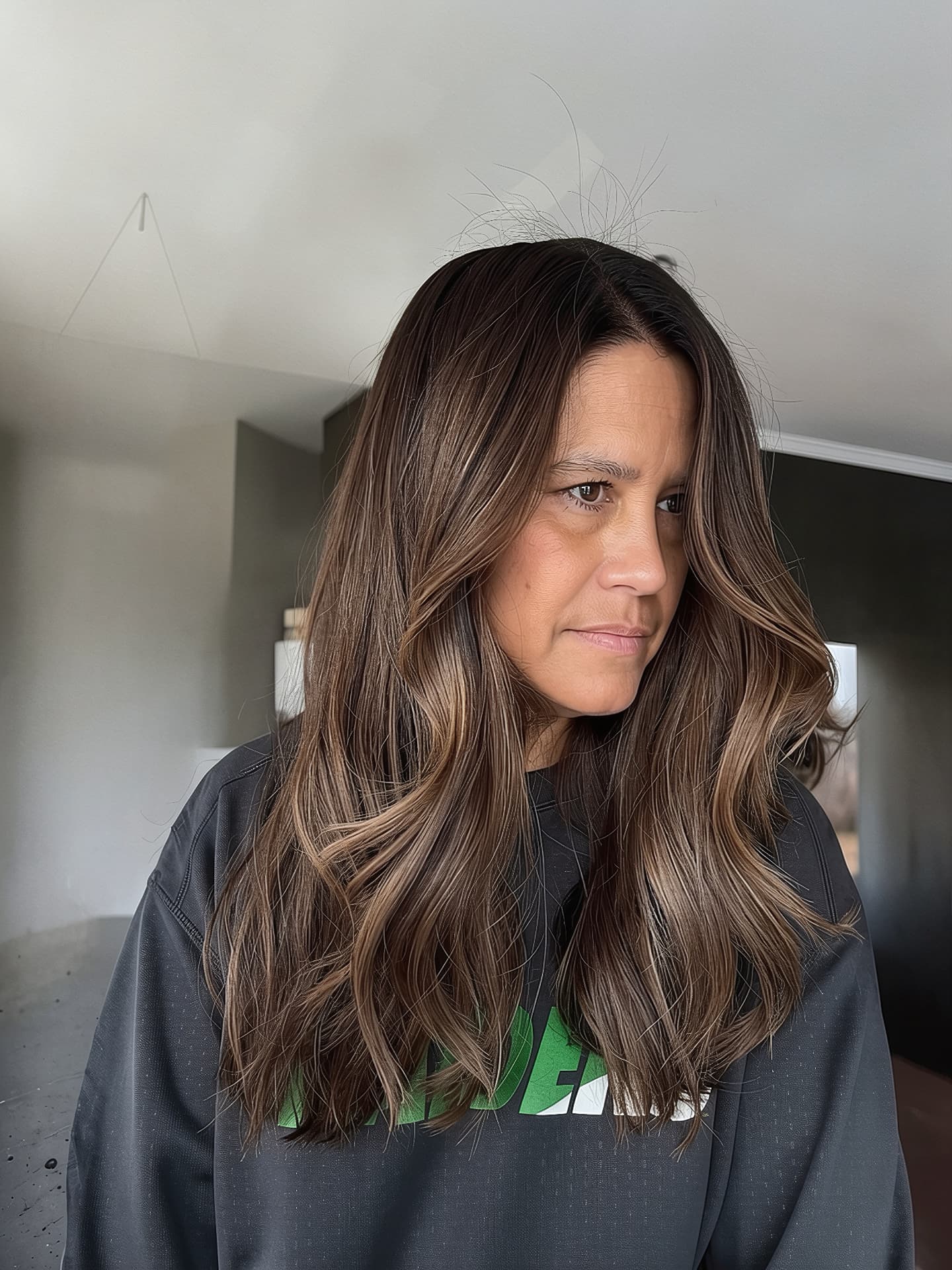Long brunette balayage with caramel ribbons and soft waves by Mill & Mane, Tipp City