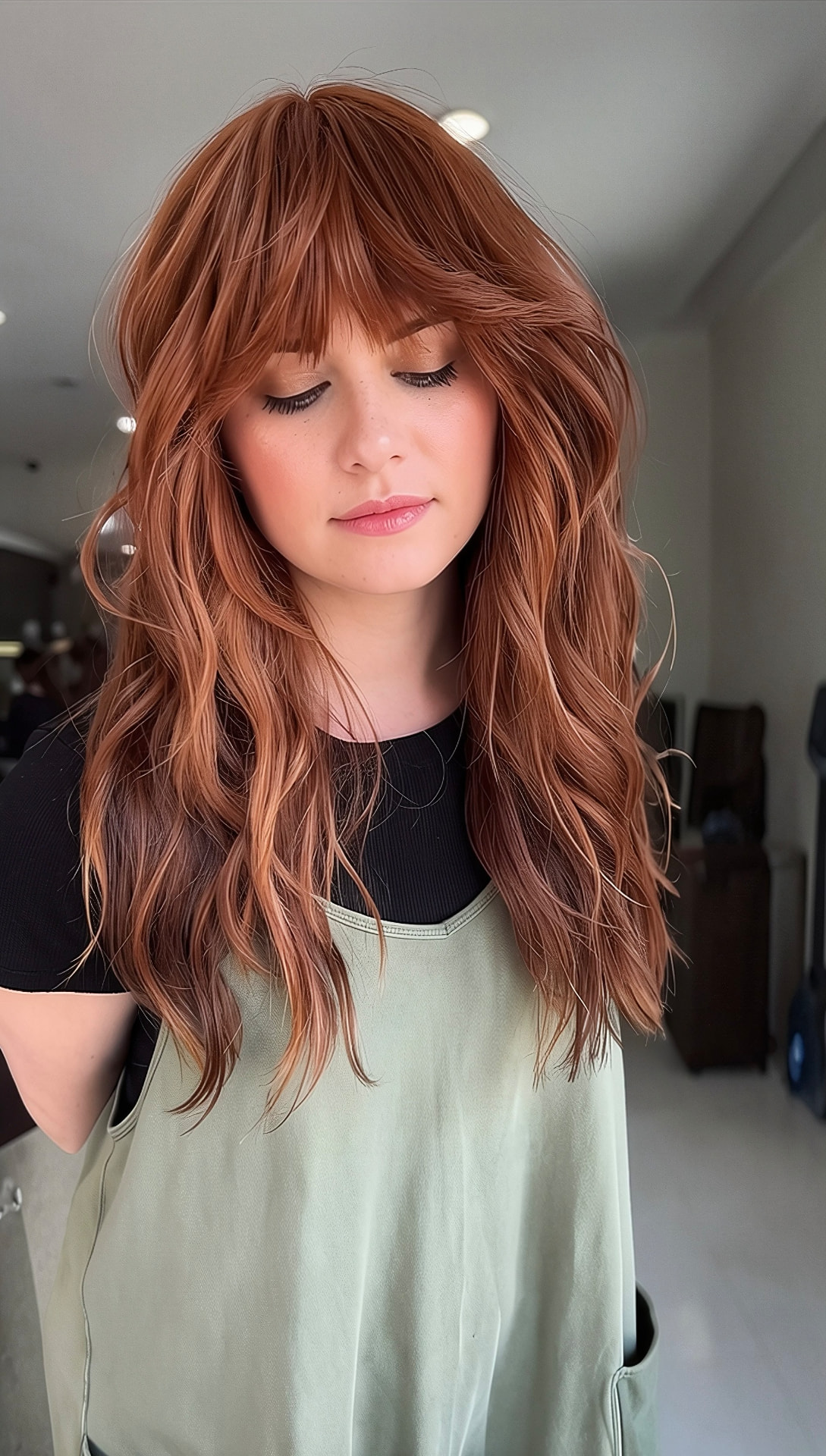 Copper red long shag with curtain bangs and beachy waves by Mill & Mane, Tipp City