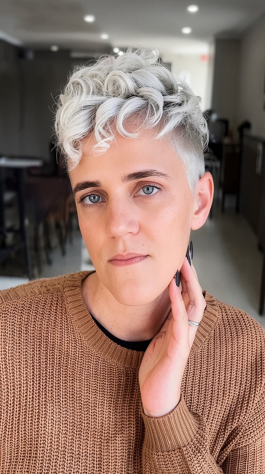 Icy platinum textured pixie cut with soft curls by Mill & Mane, Tipp City